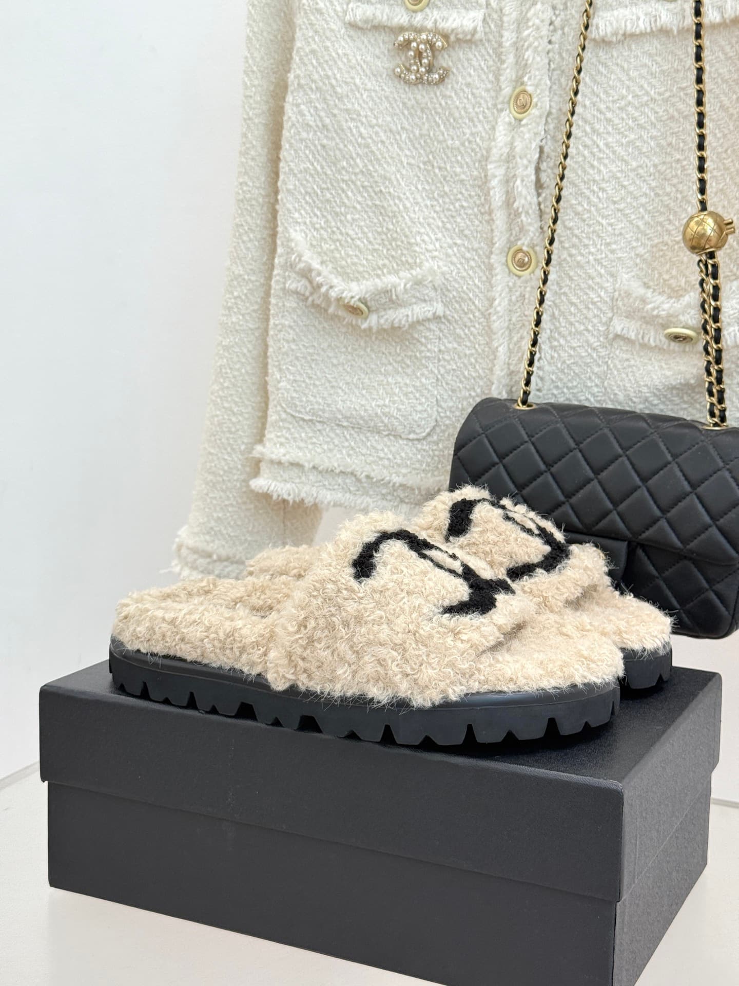 Chanel Chanel CHANE Classic Chanel Double C Faux Fur Slippers—The Double C is the essence of the classic design, and the thick sole subtly