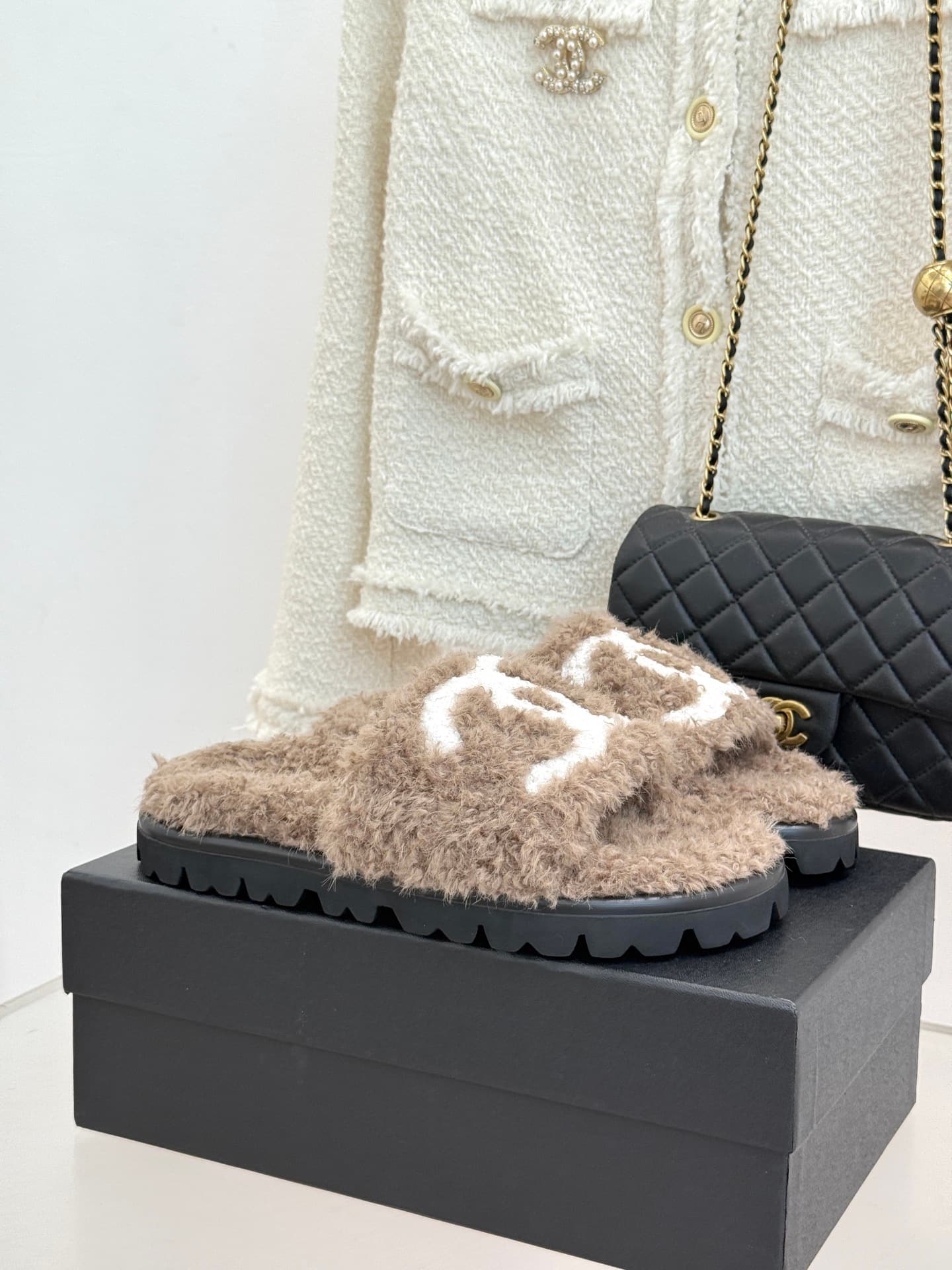Chanel Chanel CHANE Classic Chanel Double C Faux Fur Slippers—The Double C is the essence of the classic design, and the thick sole subtly