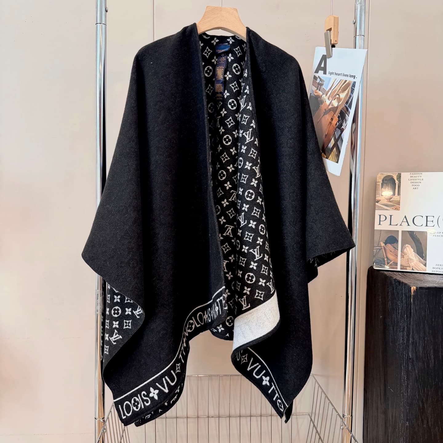 Louis Vuitton Louis Vuitton This cape-style wool coat literally embodies "understated luxury." The misty gray hue...